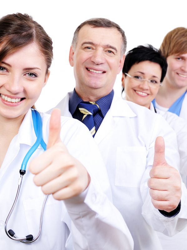 group-happy-laughing-doctors-with-gesture-thumbs-up-standing-line